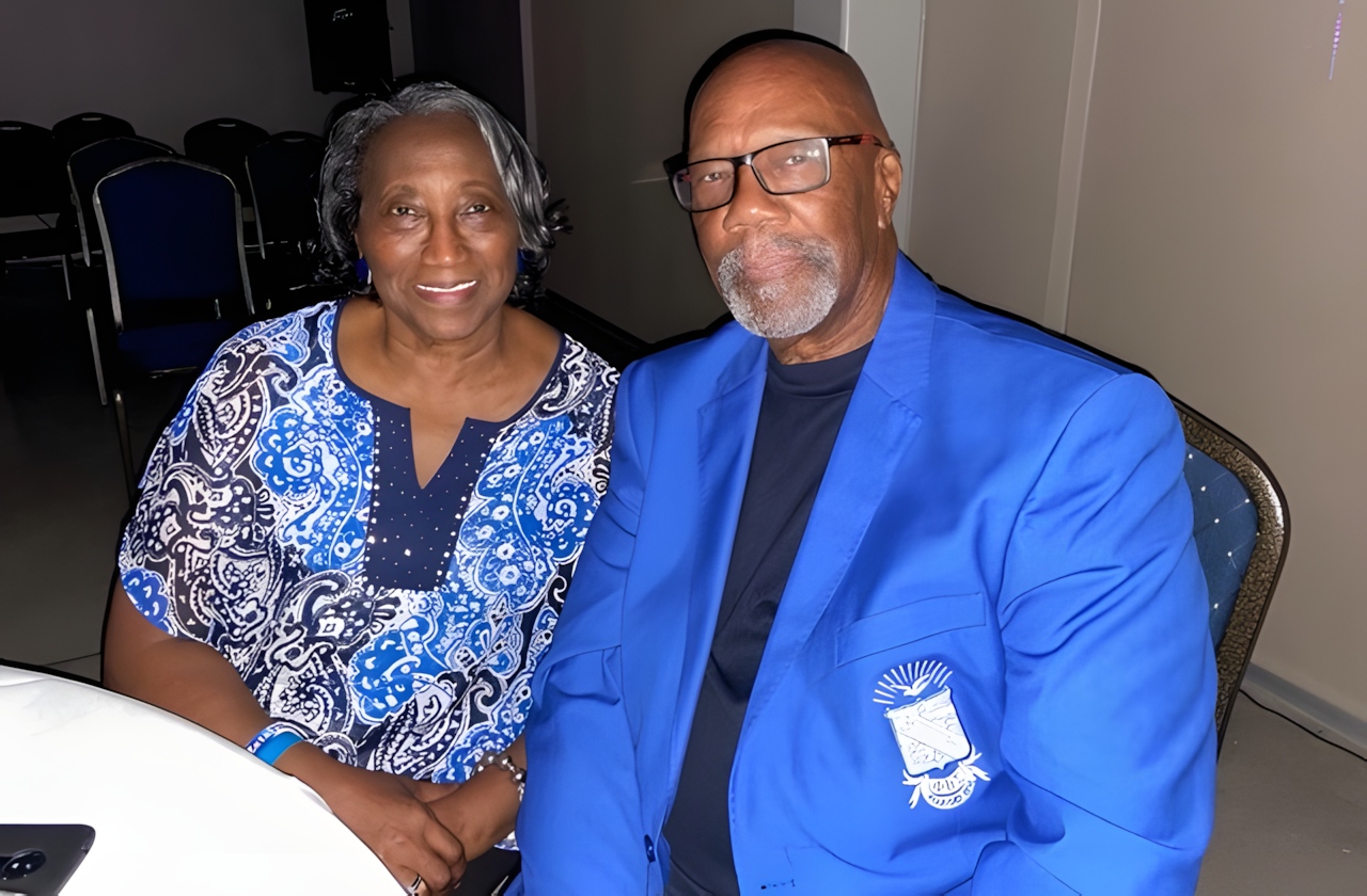Robert and Marin McLean sitting and smiling.