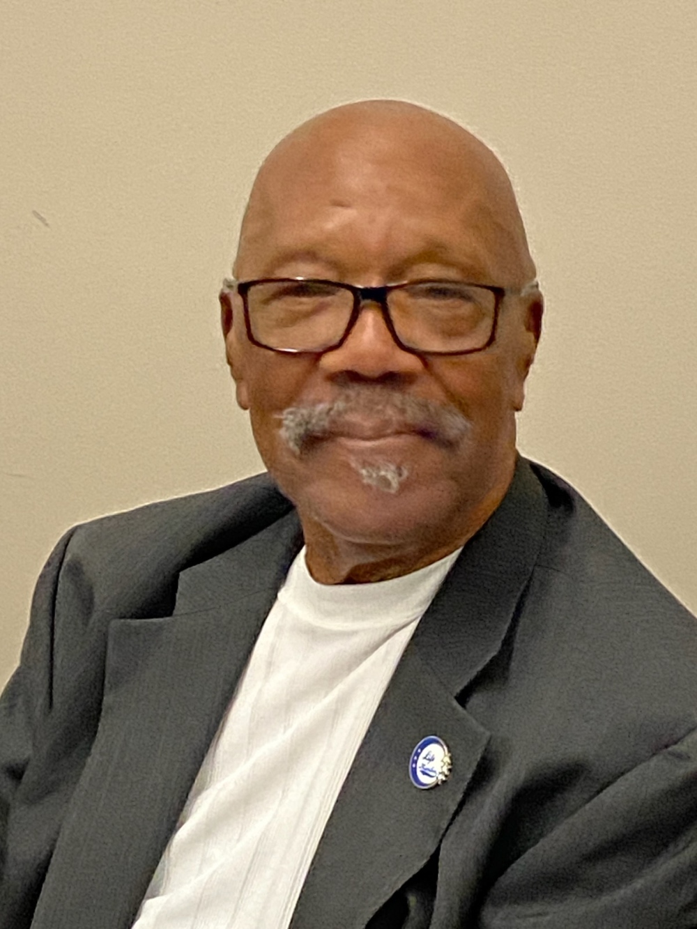 An image of Robert McLean standing and smiling.
