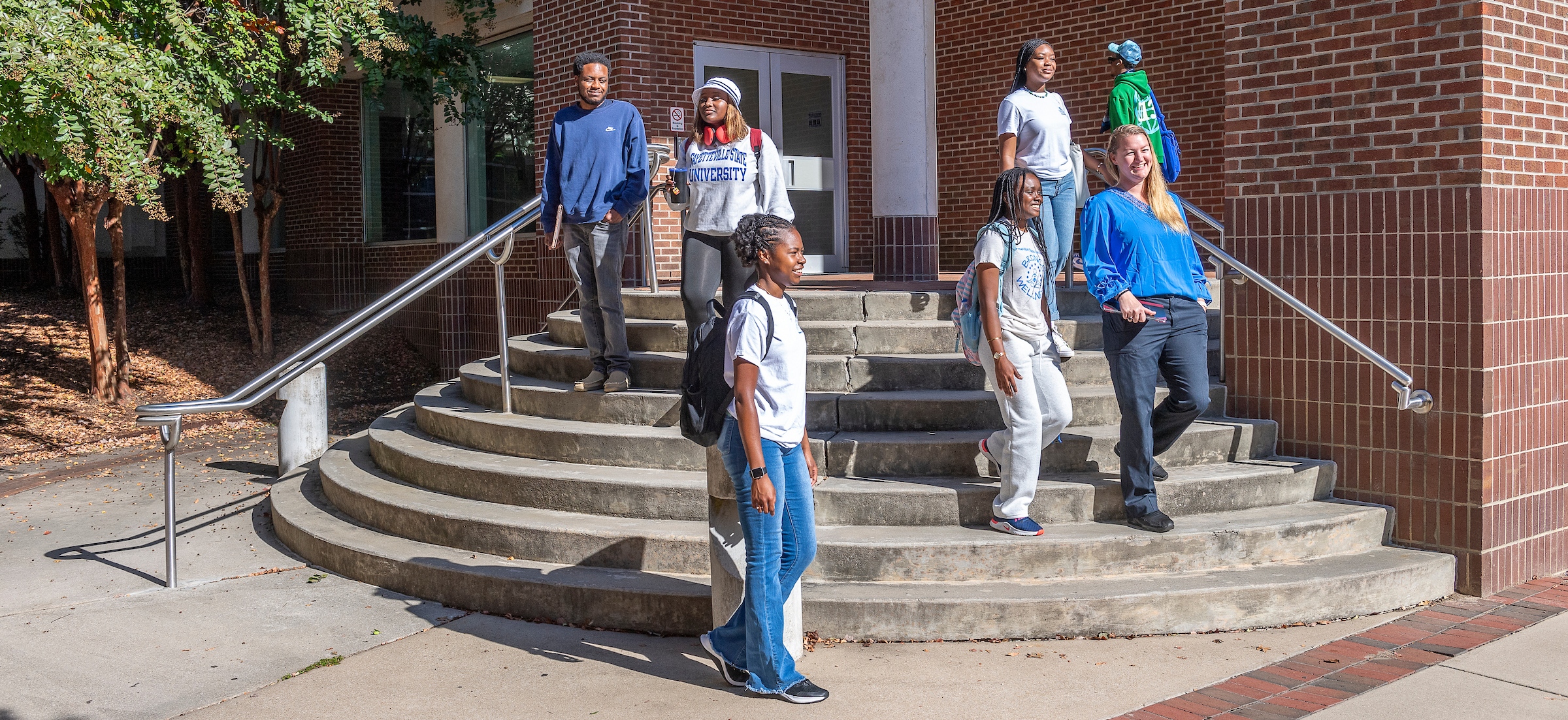 FSU Students emerging from a building.