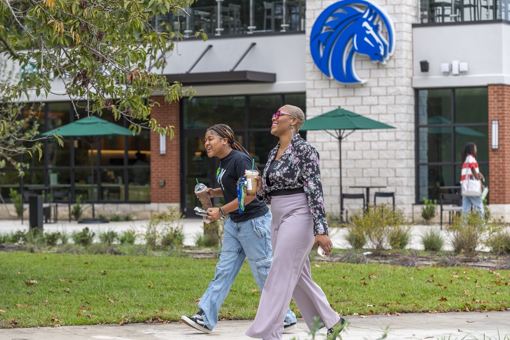 Students walking in front of starbucks