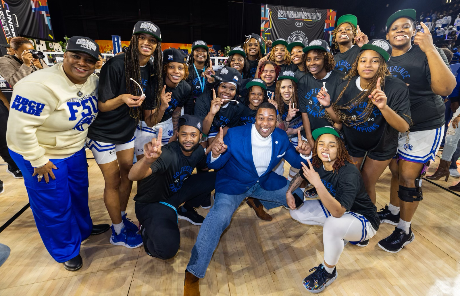 Group photo of the FSU women's basketball team and Chancellor Darrell Allison