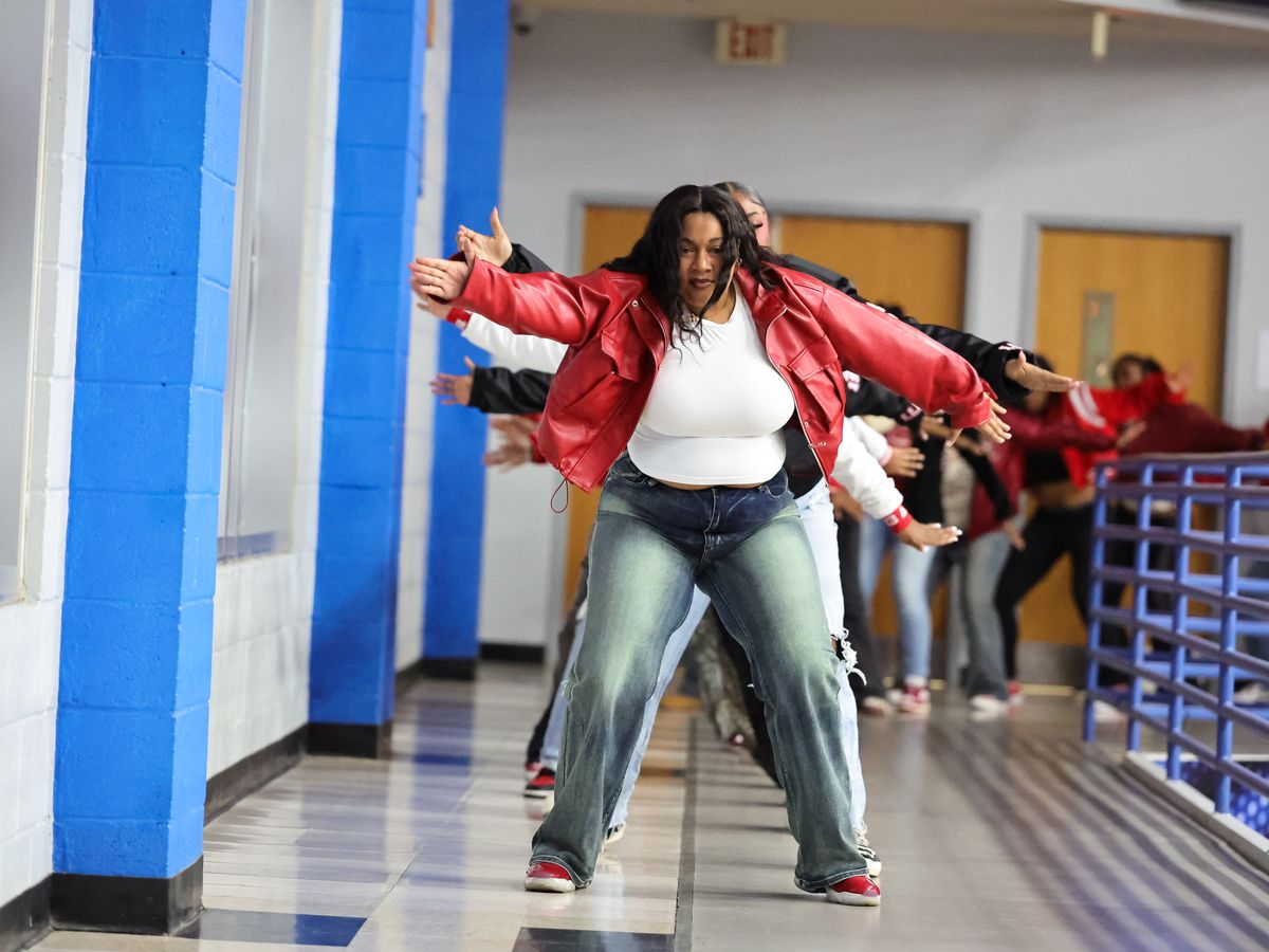 Members of an FSU sorority stepping in line through an arena corridor during Greek Night at a Broncos basketball game
