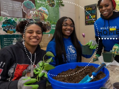 Three FSU students in gloves potting seedlings together during a campus service learning project