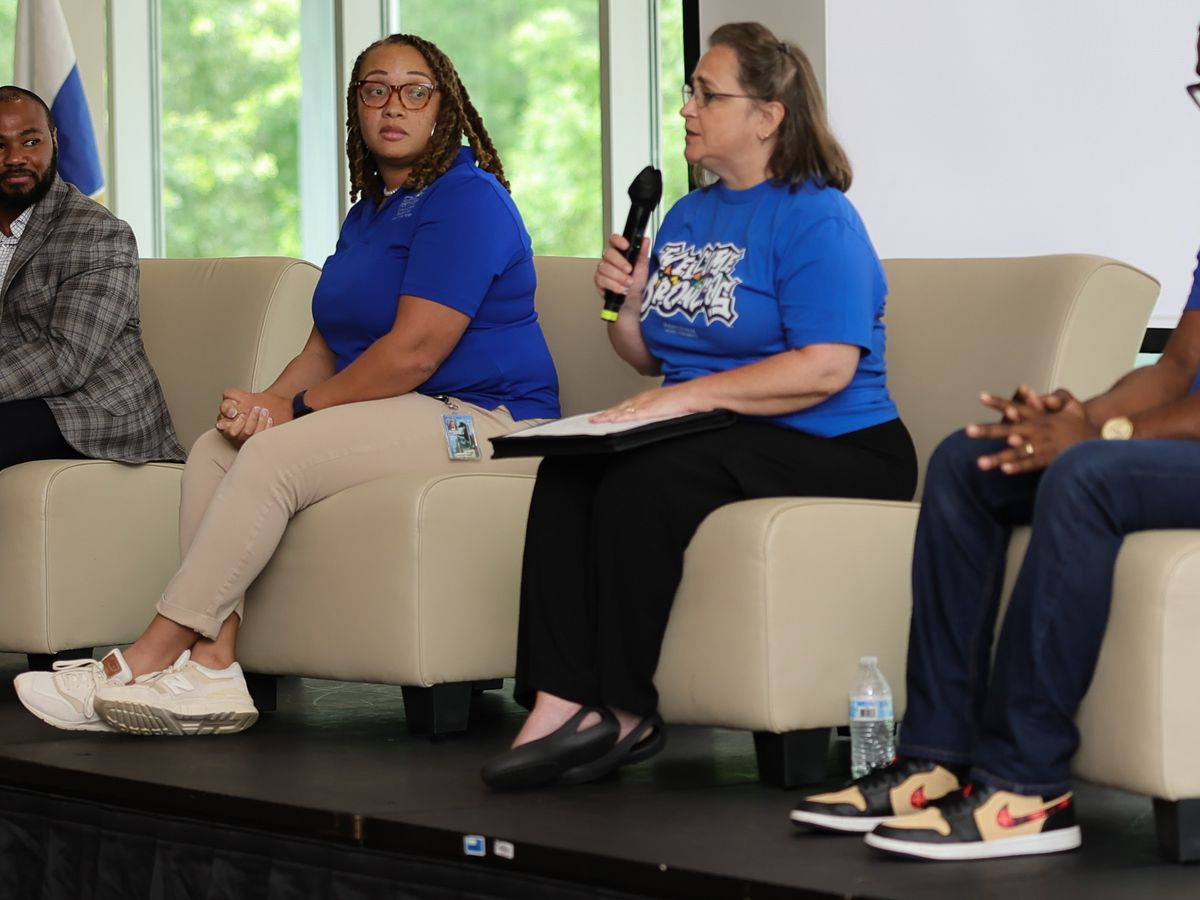 FSU staff and student leaders answering questions from a panel on stage during New Student Orientation