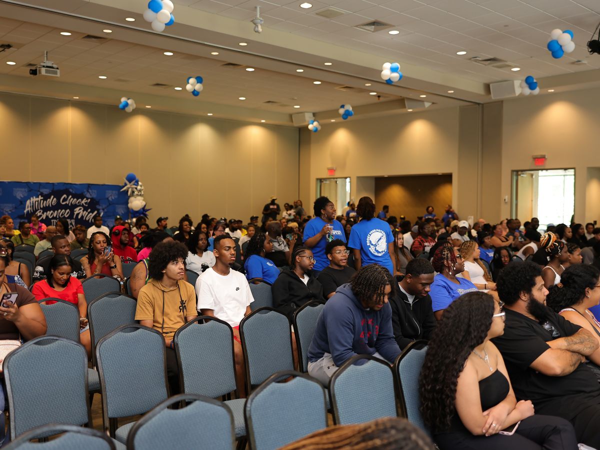 Students seated with their parents and families at an FSU New Student Orientation session