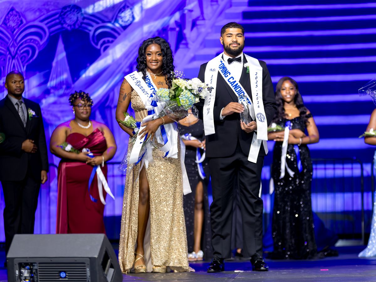 Members of the FSU royal court on stage at Coronation, with the Miss FSU and Mr. FSU first runners-up holding bouquets and an award