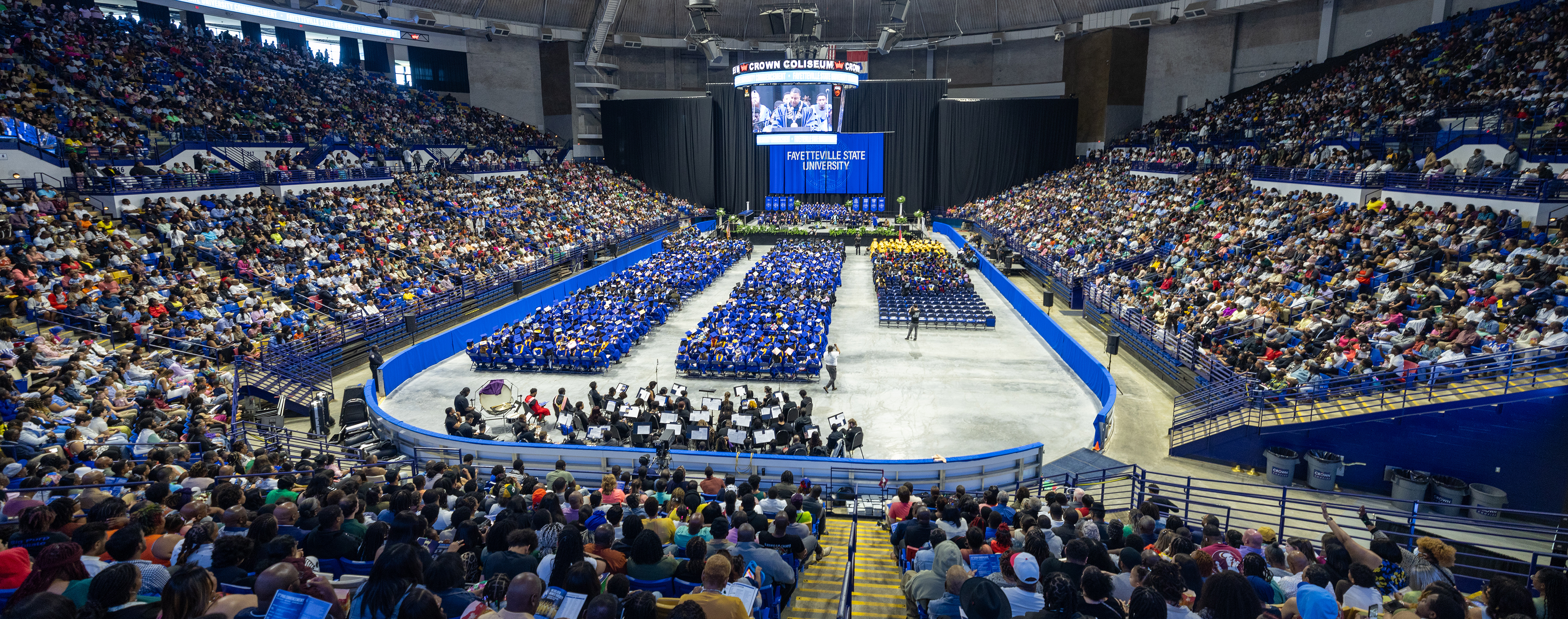 a filled Crown Coliseum Complex overlooking the FSU graduates during the 2024 Spring Commencement ceremony
