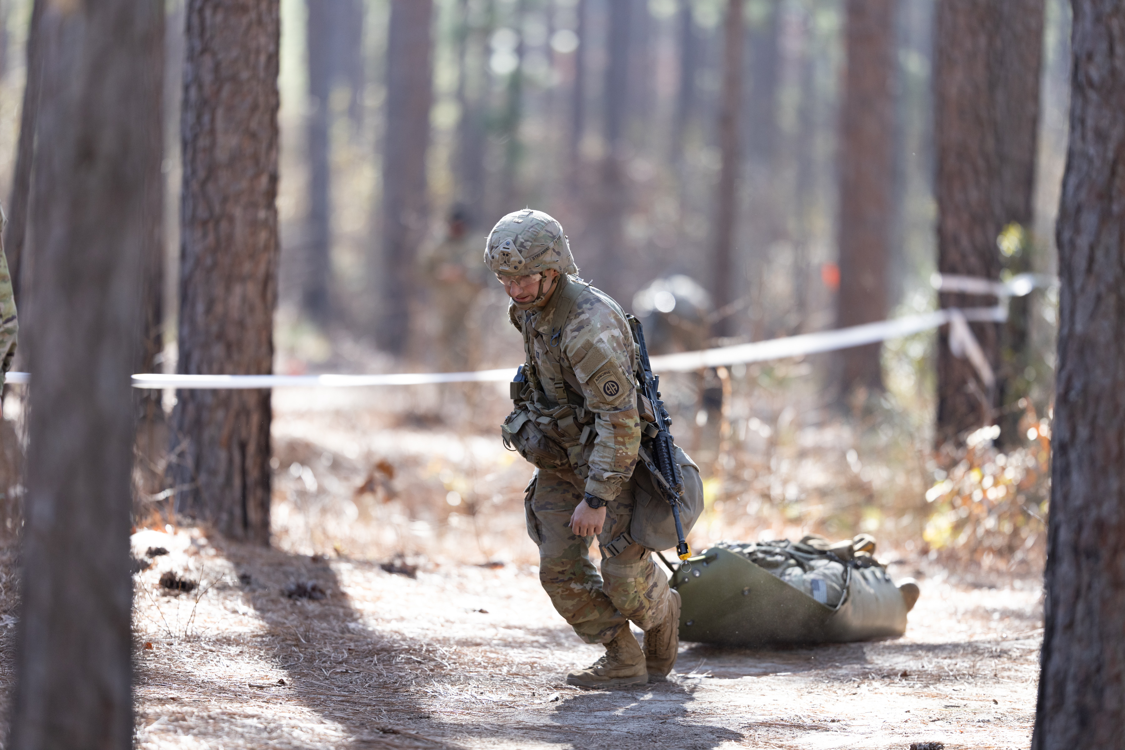 Soldier performing pulling wounded soldier during training