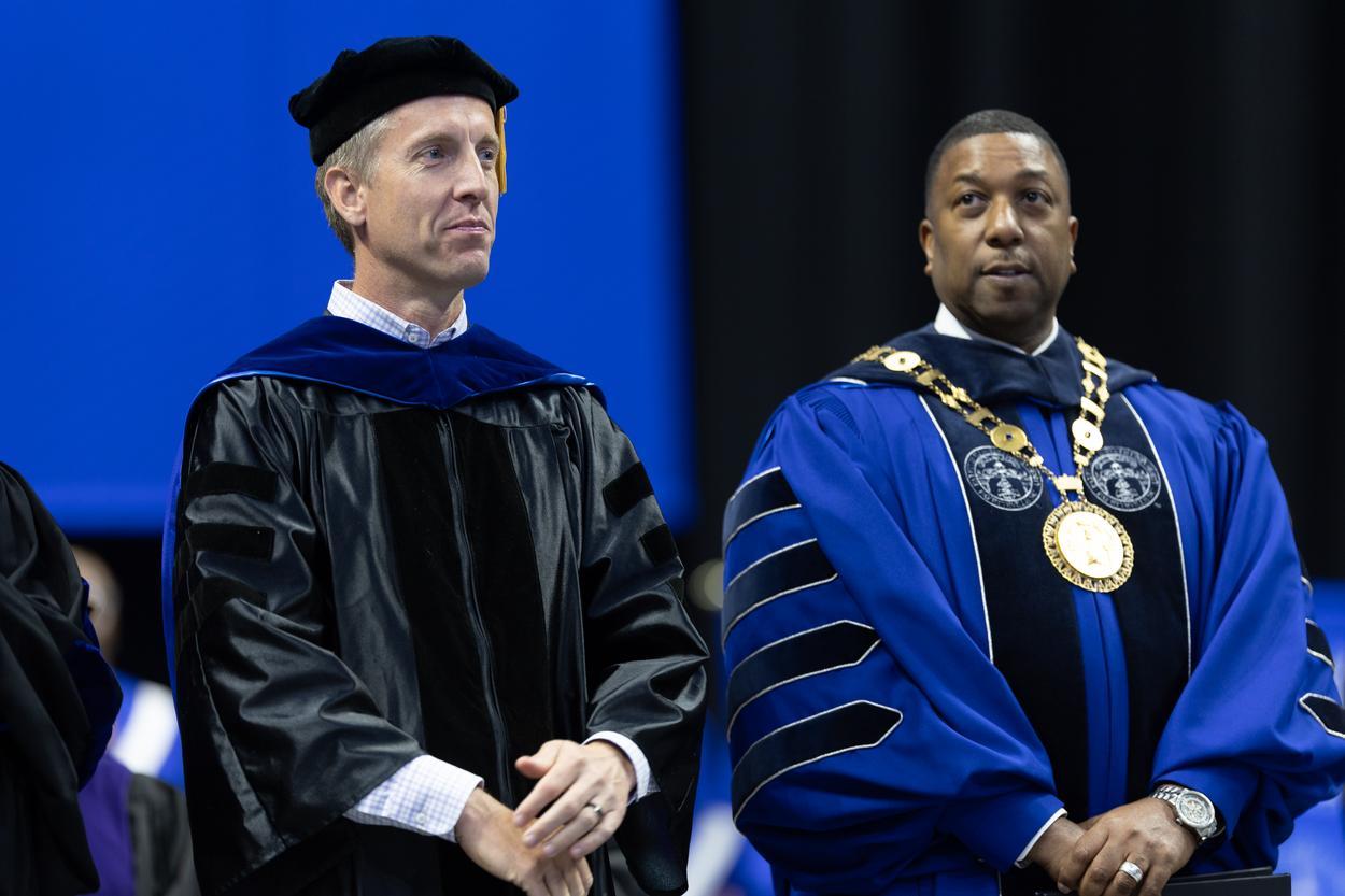 The Chancellor standing with a distinguished Gentleman.
