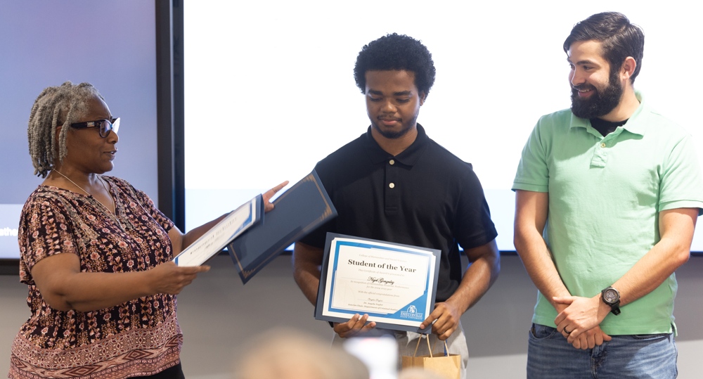 Nigel, presented with an award.