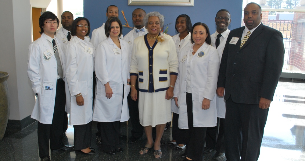Dr. Valeria Fleming surrounded by students.