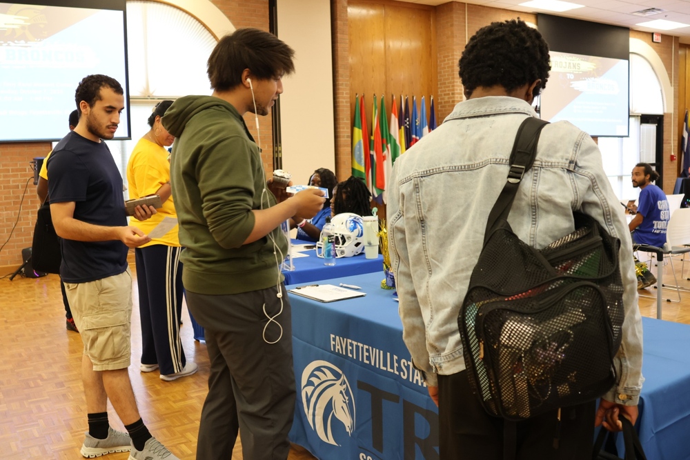 College students gather at a Fayetteville State University outreach table