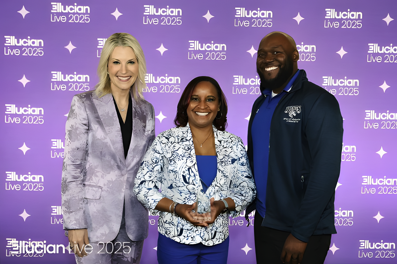 Dr. Pamela Baldwin and Mr. Vincent Harris Jr. accept the Ellucian Impact Award from Laura Ipsen, President and CEO of Ellucian.