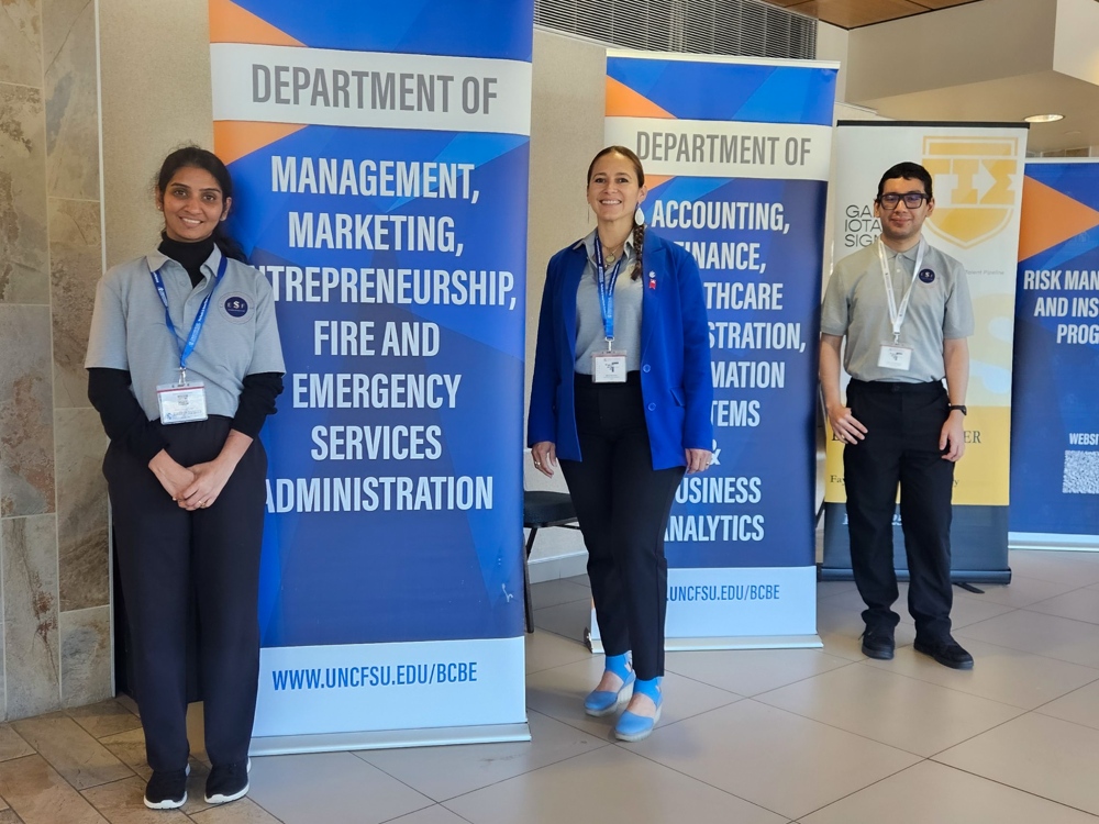 Team captains smiling beside banners.