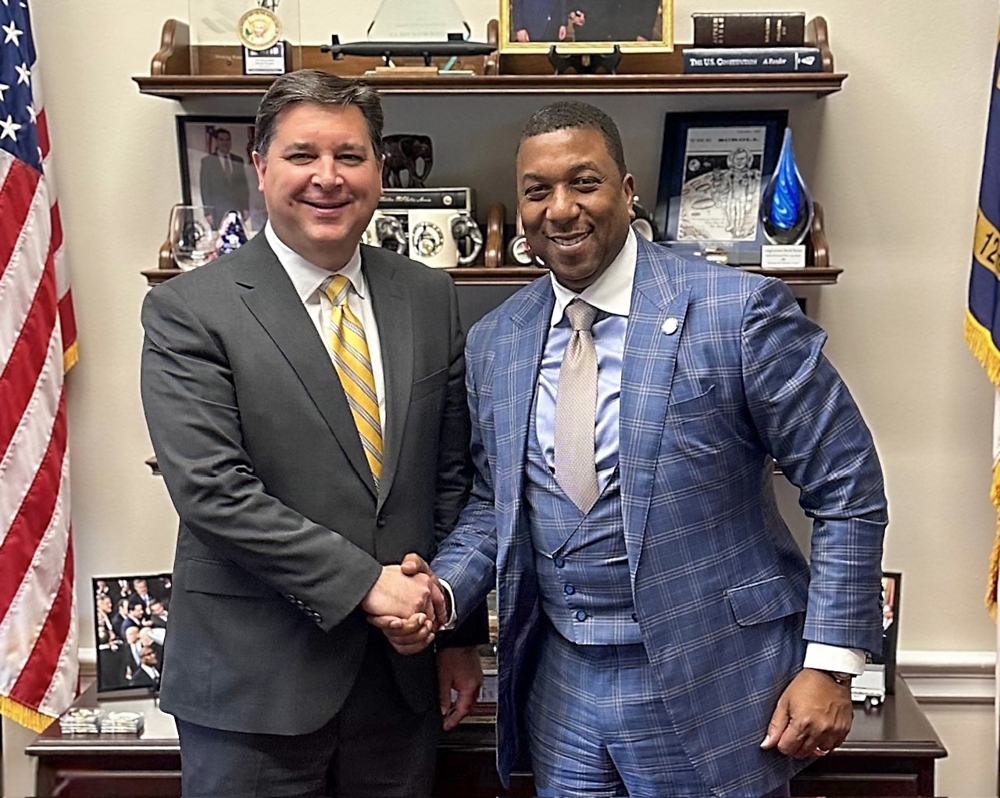 Chancellor Allison shaking US Rep David Rouzer's hand.