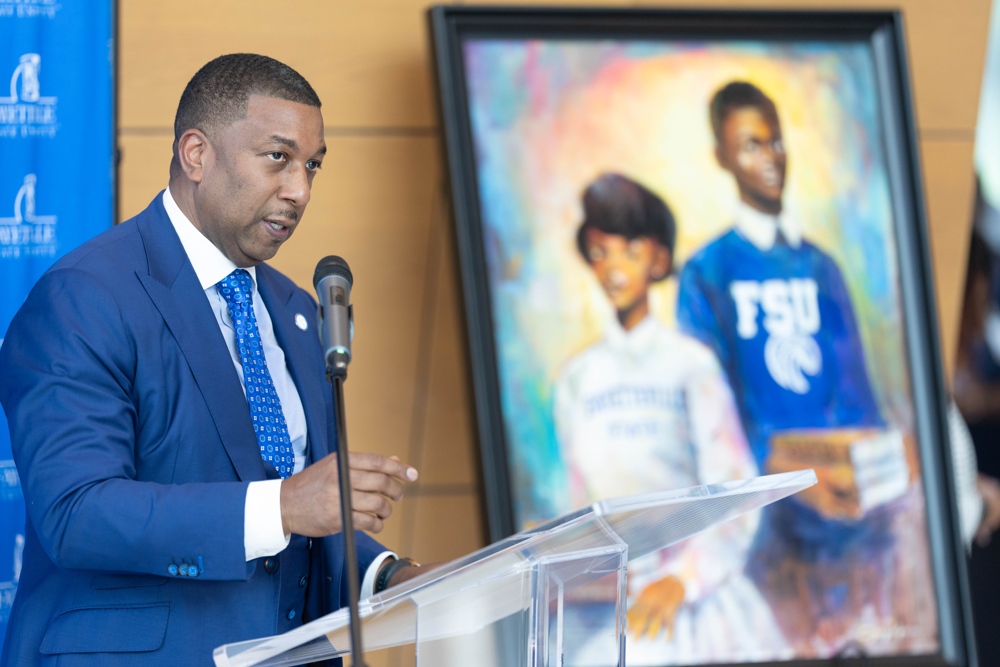 The chancellor speaking at a podium
