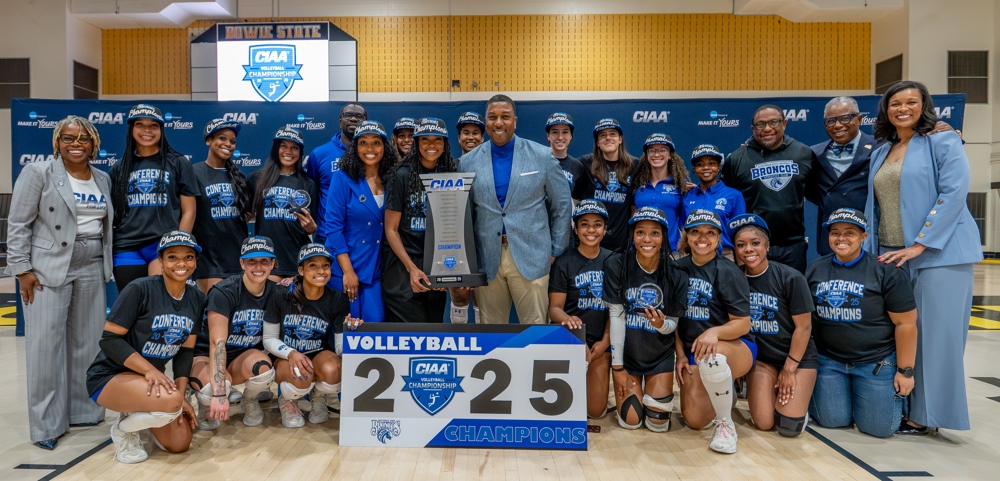 The Chancellor standing with our winning team.