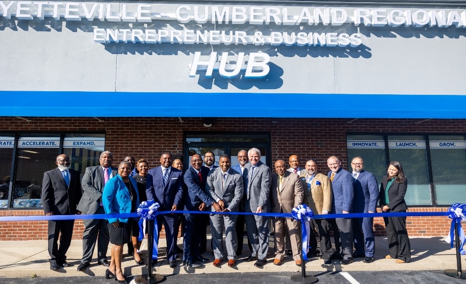 The Chancellor performing a ribbon cutting at the Business HUB.